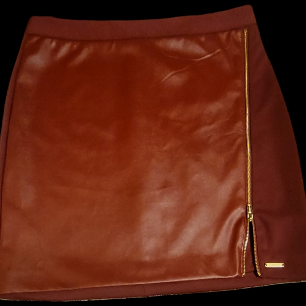 GUESS Women's Faux Leather miniskirt. Size Medium. Bordeaux in color.